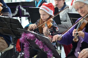 SMSG band violinists play carols