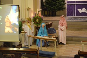 An angel, Mary, baby Jesus and Joseph