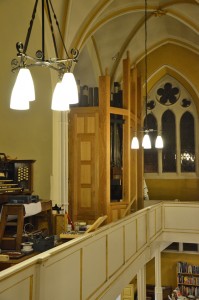 The Great and Choir casework in place (with finials) enclosing the pipes.
