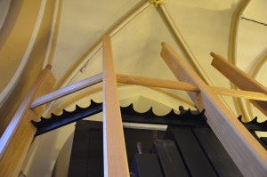 The pipe supports (black) in position in the Swell casework upper frame.