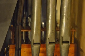 Close up of Great top note chest behind 3 open diapason pipes