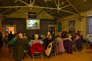 Volunteers watch the organ video
