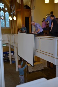 Lowering the big screen into position