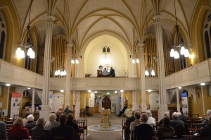 The audiences listens to Stephen playing the Willis organ