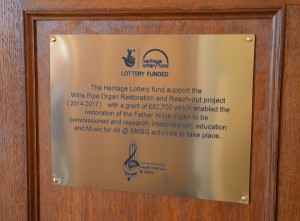 Plaque on the organ about the project