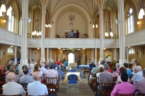 The audience listens