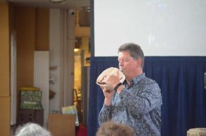 Demonstrating a conch shell trumpet