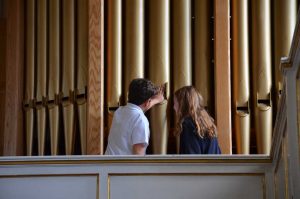 Two Year 5 children feeling the organ pipe sound