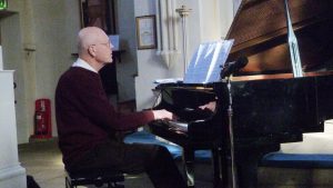 Geoffrey at the piano