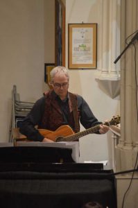 Craig playing guitar for Christmas Bells