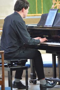 Adam played using a tablet computer for his sheet music