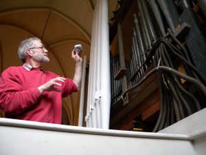 Mr Storer pointing at pipes with his magic light