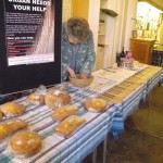 Sylvia checking the Raffle and Cake takings