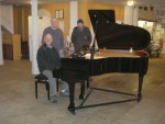 David sits at the keyboard whilst Fred and helper look on