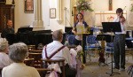 Jacob and his teachers laugh together before their trio