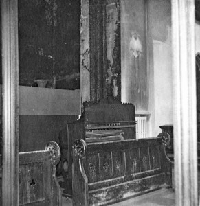 Odell's harmonium behind the choir stalls which was loaned after the fire